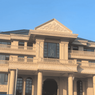 白山黄金麻别墅外墙干挂石材效果示例