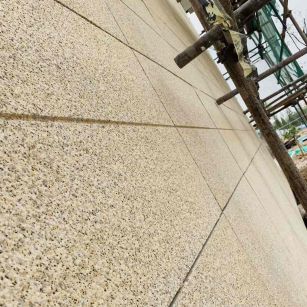 白山 黄金麻花岗岩荔枝面外墙干挂石材效果示例